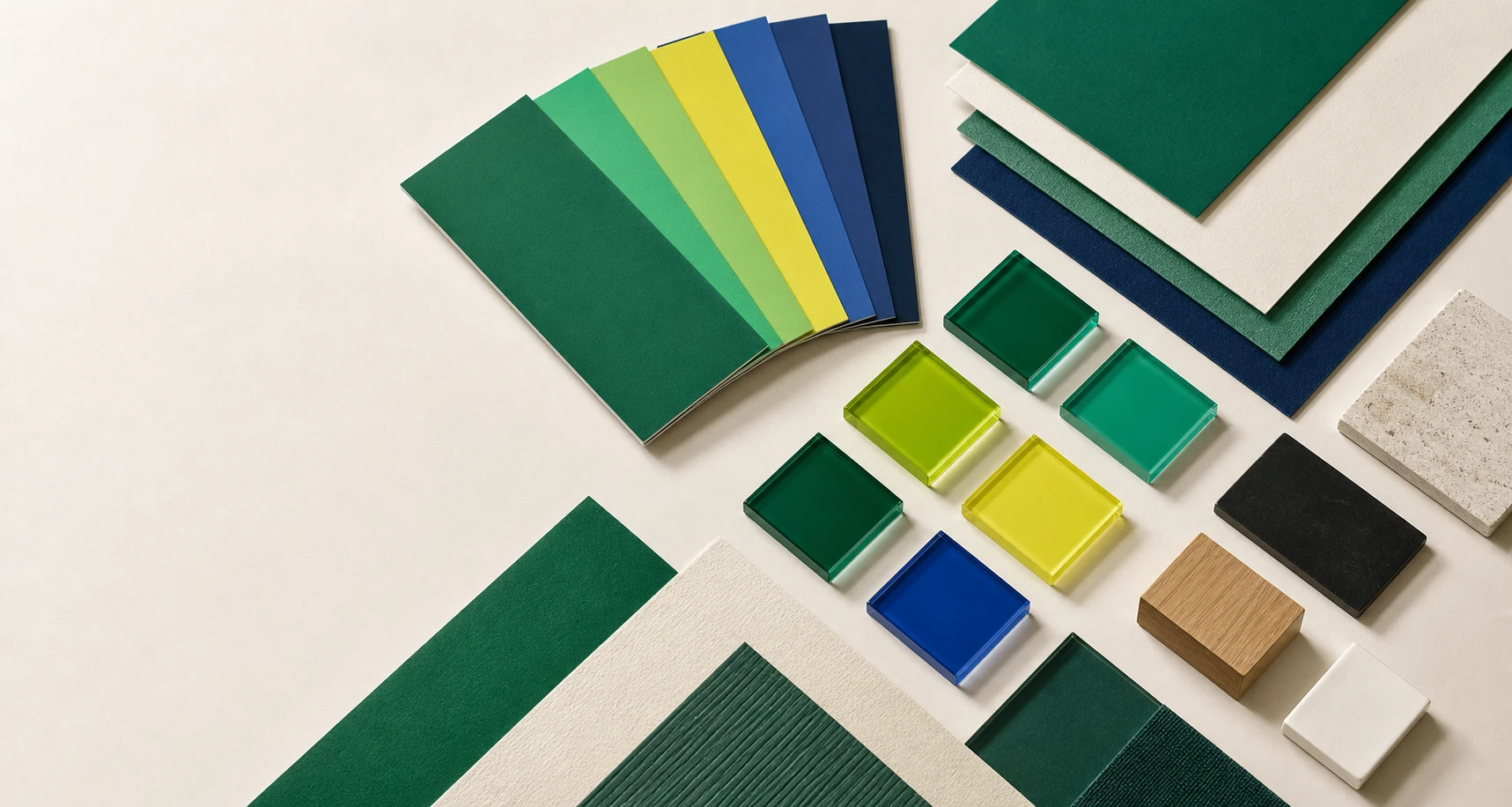 Muestrario editorial con papeles y materiales en los colores institucionales de GLA.